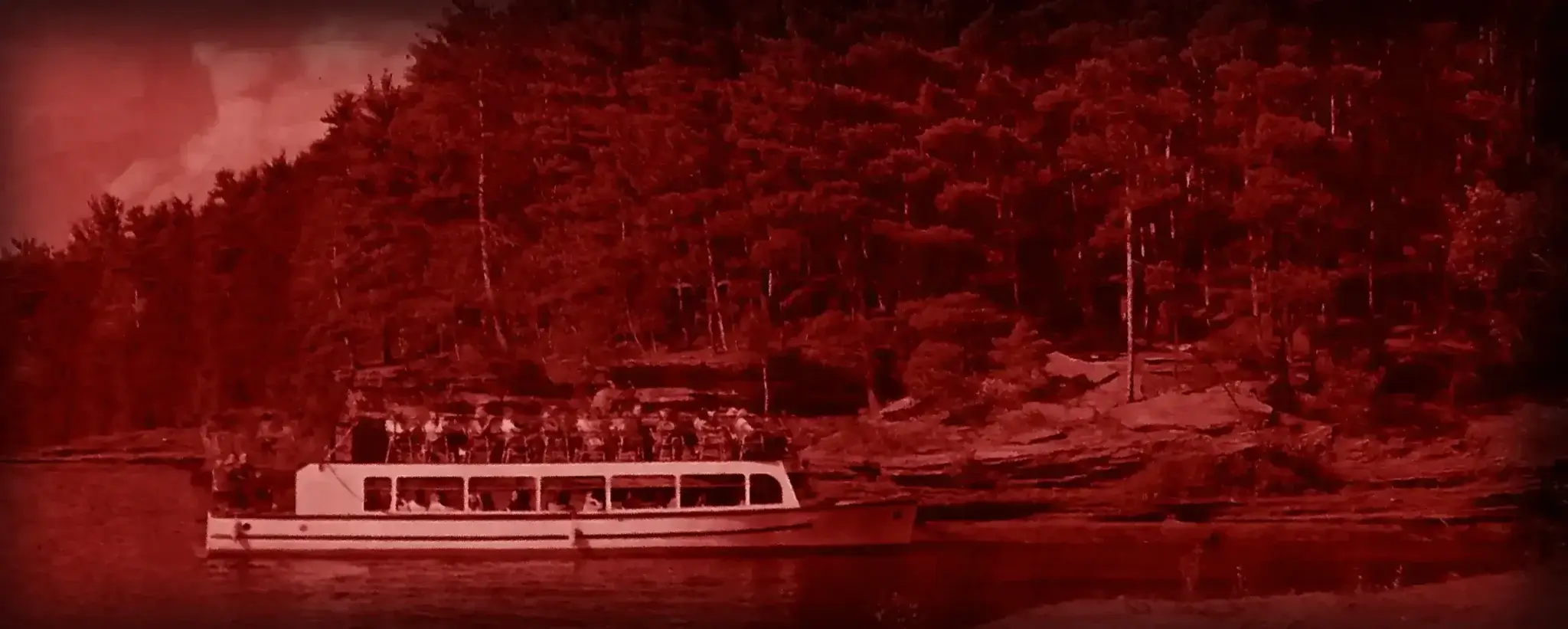 Ghost Boat on the Dells water after dark